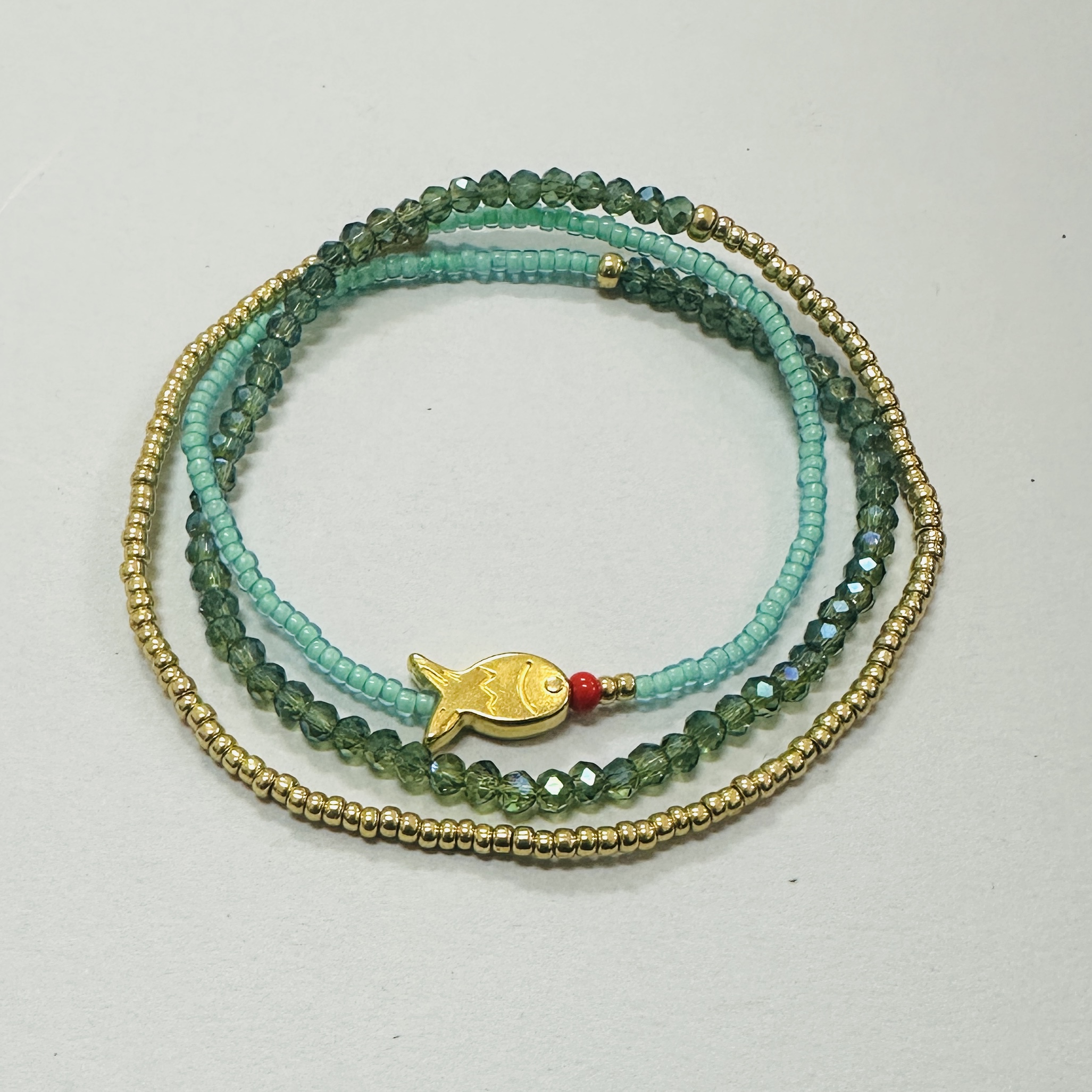 Beaded Triple Wrap Bracelet in Shades of Turquoise with a Gold Fish
