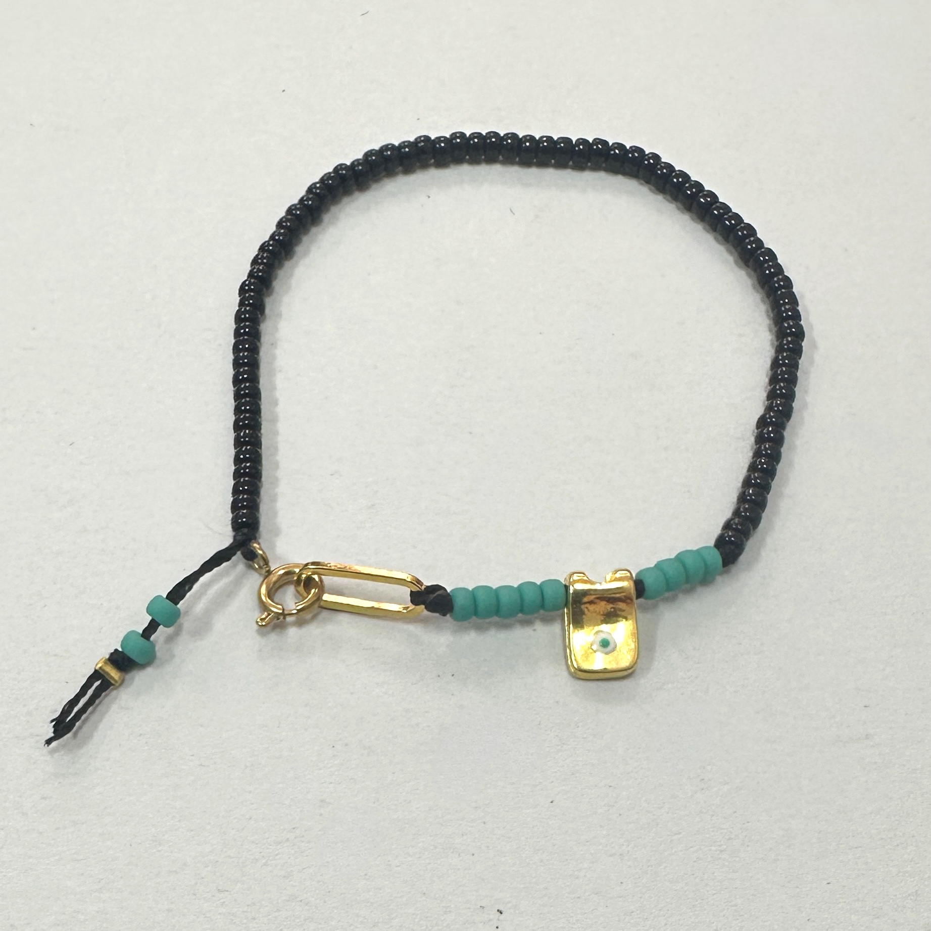 Black and Turquoise Beaded Bracelet with Evil Eye Charm
